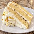 Representative slice of cannoli torte with ricotta cream and chocolate chips